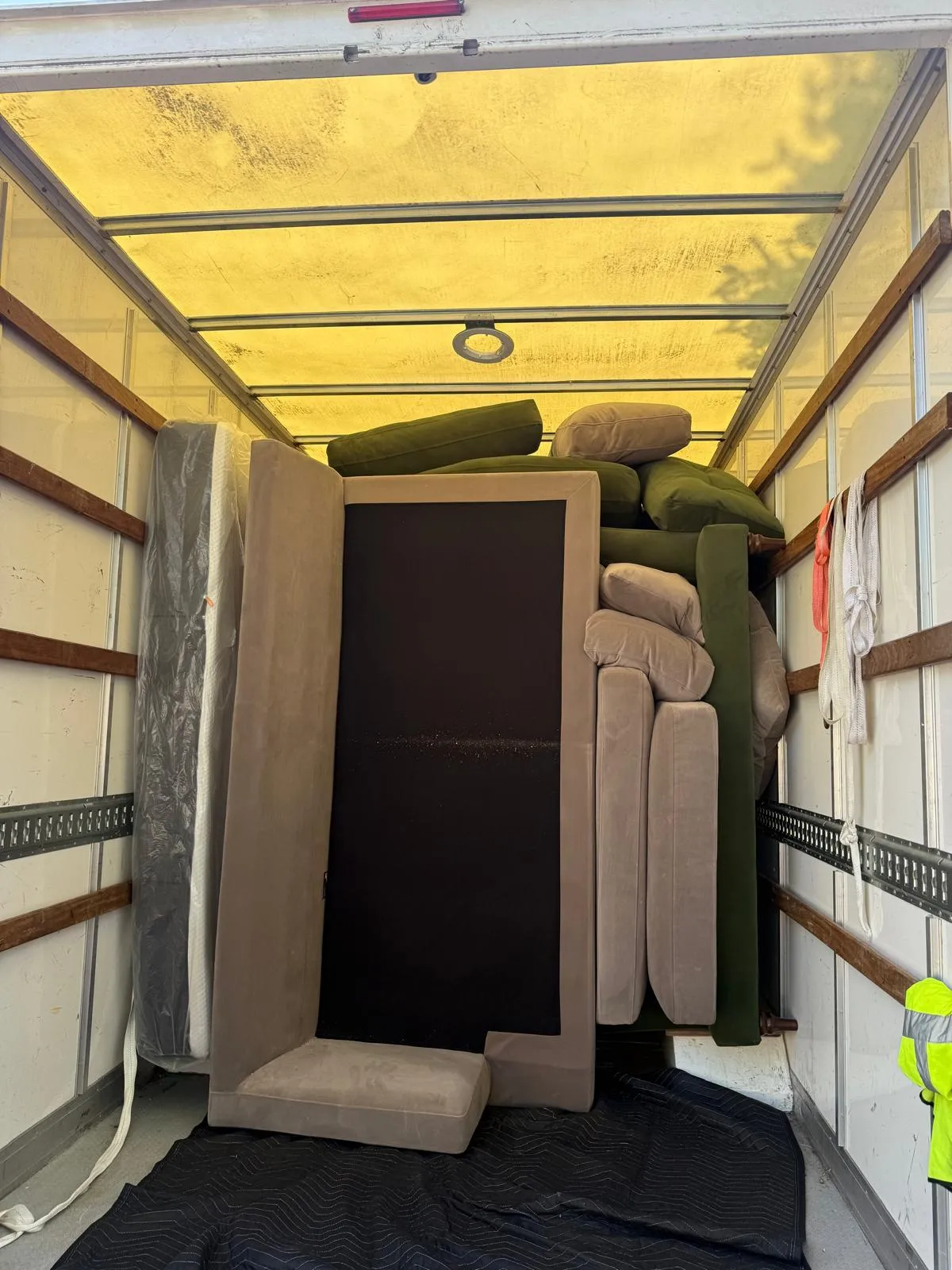 Crew carrying furniture into a Manchester apartment block